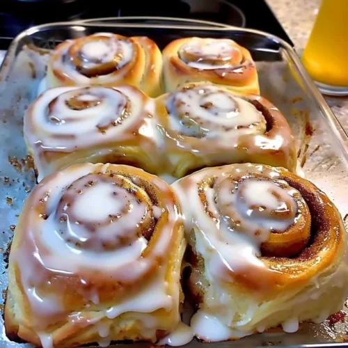 Delicious classic cinnamon rolls with creamy icing on top.