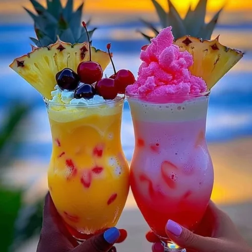 Colorful Rainbow Sherbet Piña Colada drink with tropical garnishes