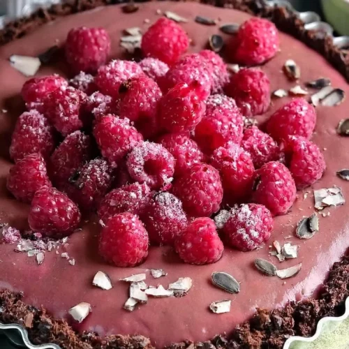 Vegan Raspberry Chocolate Tart with fresh raspberries and chocolate glaze
