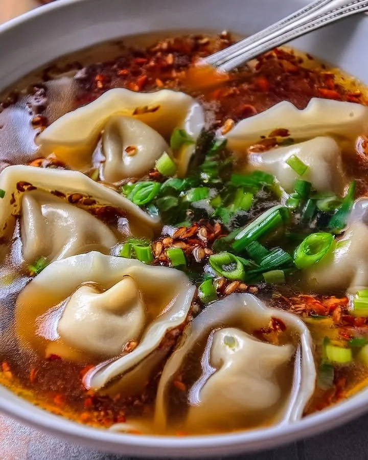 Delicious bowl of weeknight wonton soup with dumplings and fresh vegetables